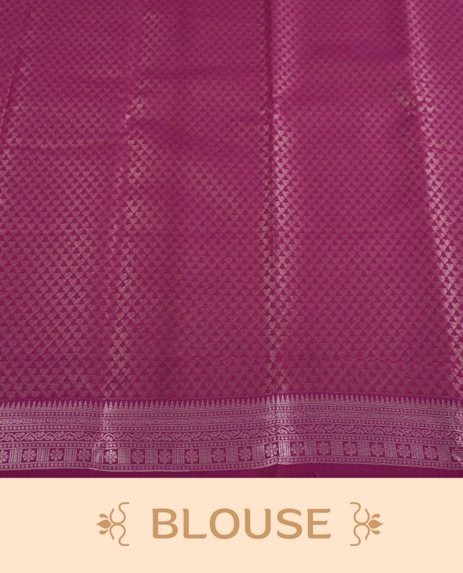 Light pink colour semi silk saree adorned with silver leaf motifs on the body, complemented by a purple pallu intricately woven with rich floral patterns border and pallu, and paired with a matching blouse