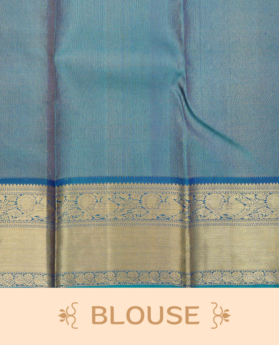 Teal blue pure wedding silk saree featuring Gold zari animal Motifs across body.complemented by self colour with traditional border, comes with matching blouse piece.