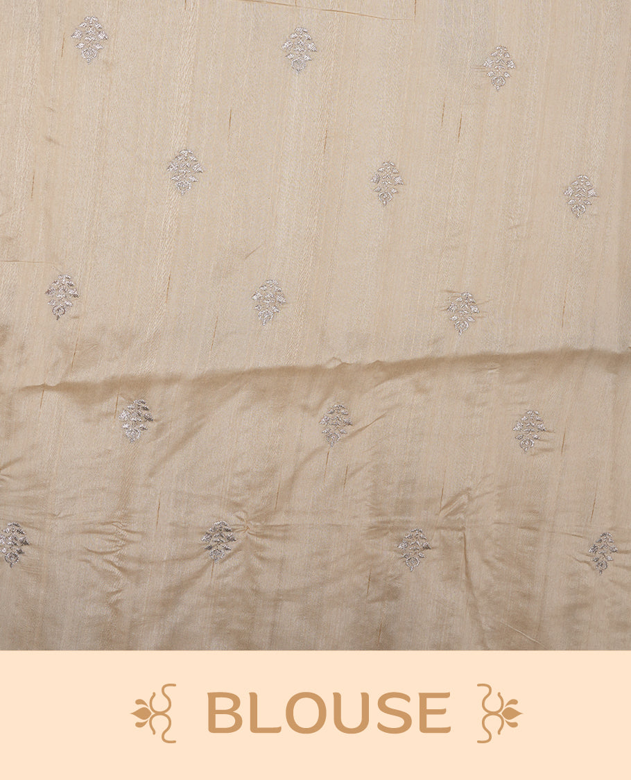 Cream colour semi tusser silk saree featuring Floral thread embroidery across body, without border and paired with matching blouse.