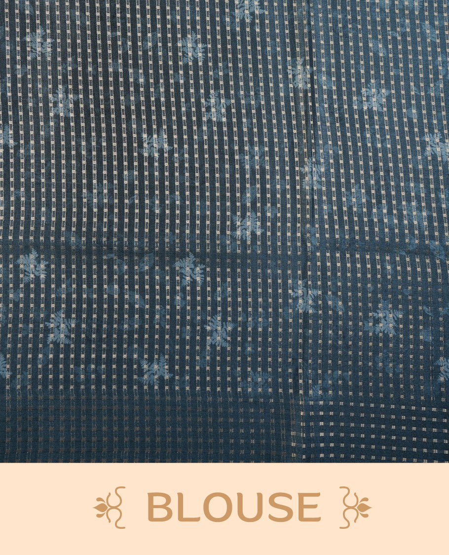 Dark green colour tussar saree featuring woven Eco leaves printed on the body, complemented by a self colour gold zari bindi butta border & pallu, paired with a matching blouse.