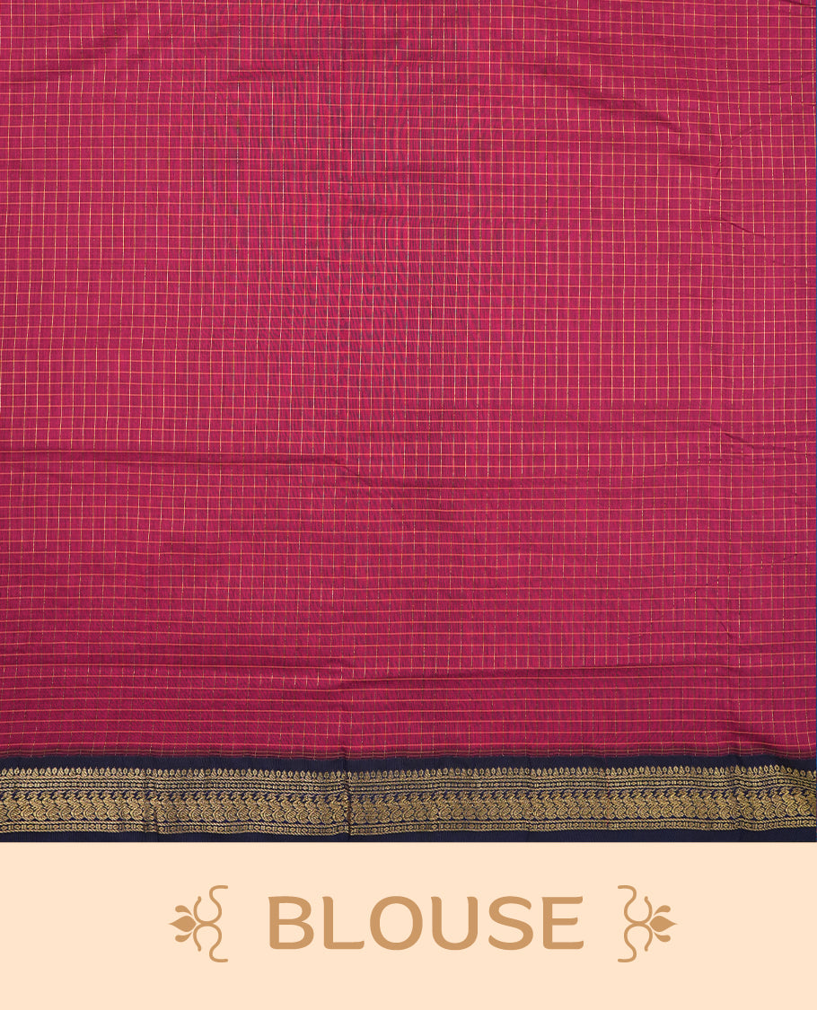 Burnt maroon coloured mixed Kalyani cotton saree featuring golden zari checks on the body, complemented by a dark royal blue coloured border and pallu adorned with golden zari patterns, Paired with a matching blouse.