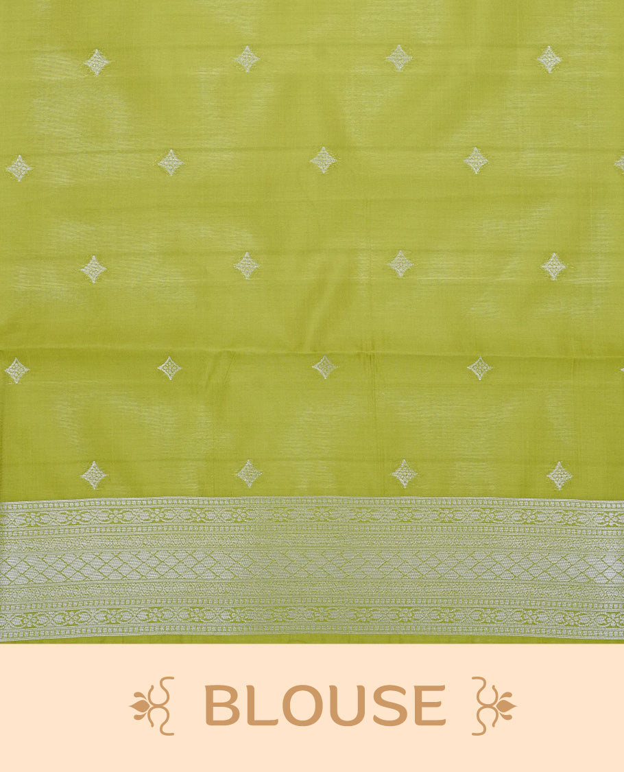Pastel yellow colour semi silk saree featuring Silver zari pattern on body, complemented by contrast Green colour with silver zari border, comes with matching blouse piece.