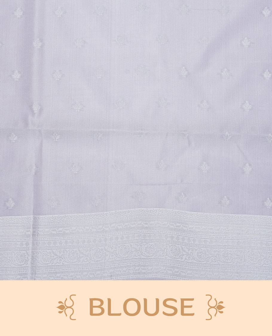 Pastel green colour semi silk saree featuring Silver zari Floral pattern on body, complemented by contrast Lavender colour with silver zari border, comes with matching blouse piece.