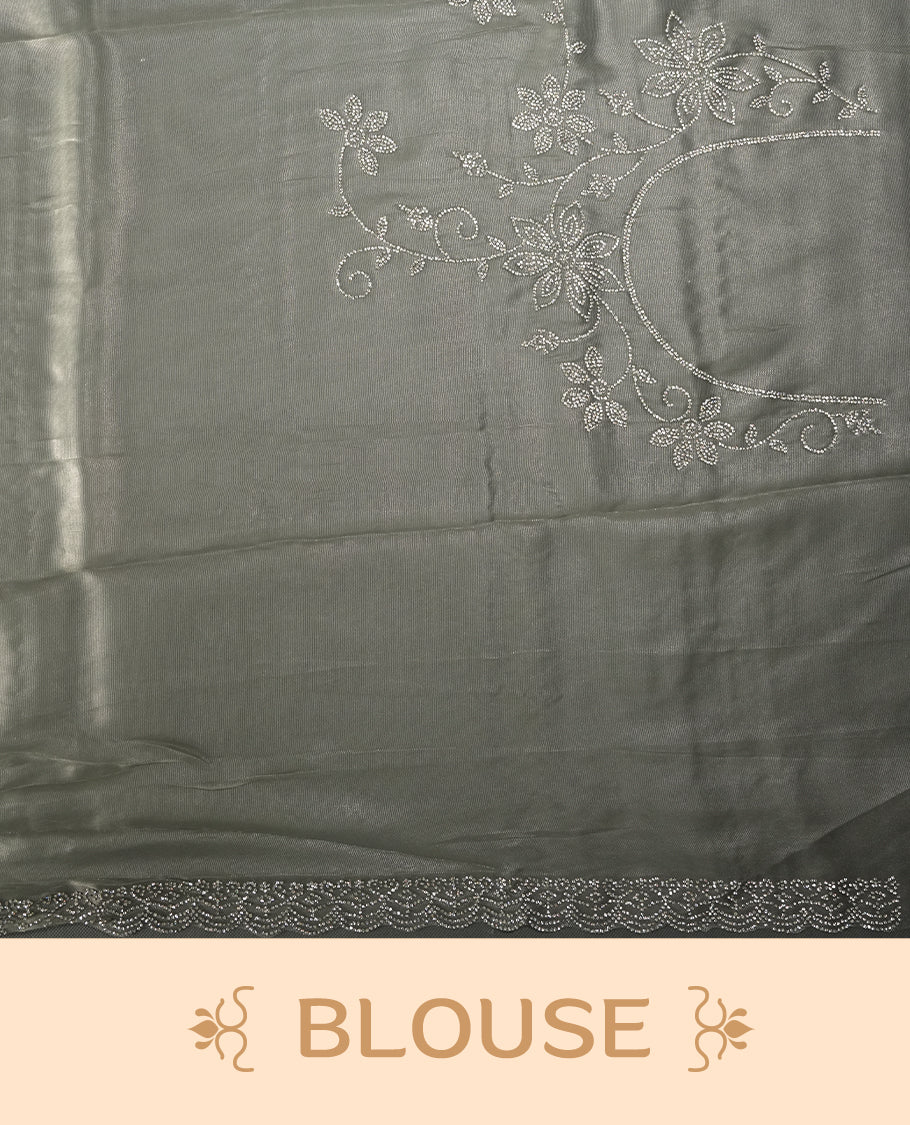 Ash Green Colour net shimmer fancy saree adorned with strip white stone buttas all over the body, paired with a delicate stone worked border and matching blouse