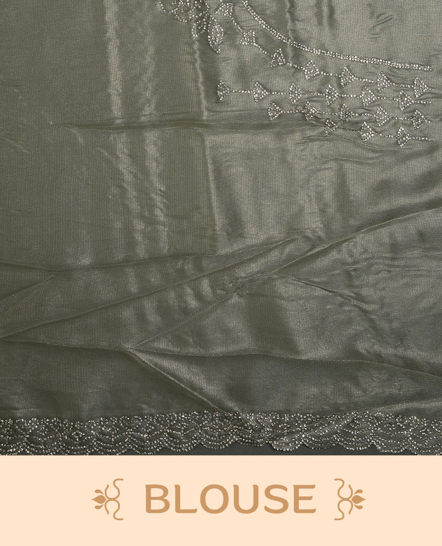 Pastel olive Colour net shimmer fancy saree adorned with strip white stone buttas all over the body, paired with a delicate stone worked border and matching blouse