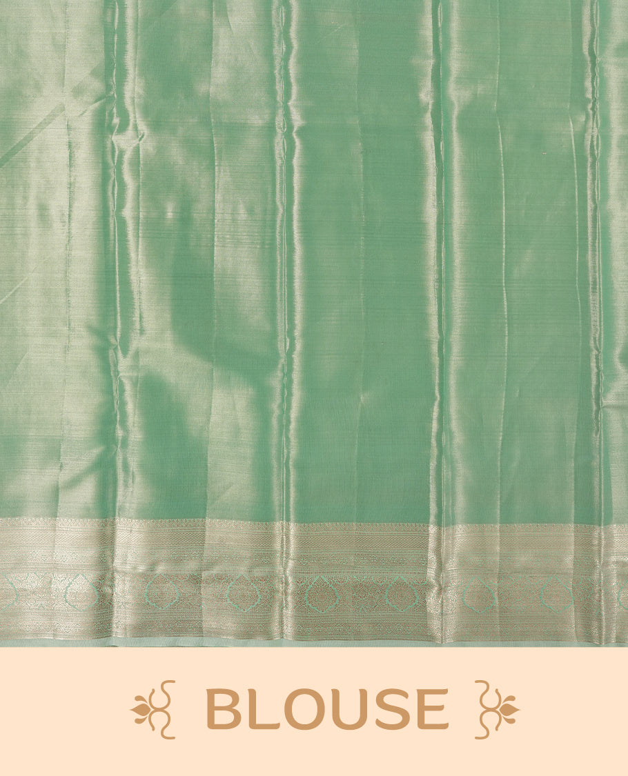 Light aqua green colour and gold Zari Tissue Brocade Saree features intricate floral Motifs on body and self coloured with traditional border & pallu, paired with matching blouse