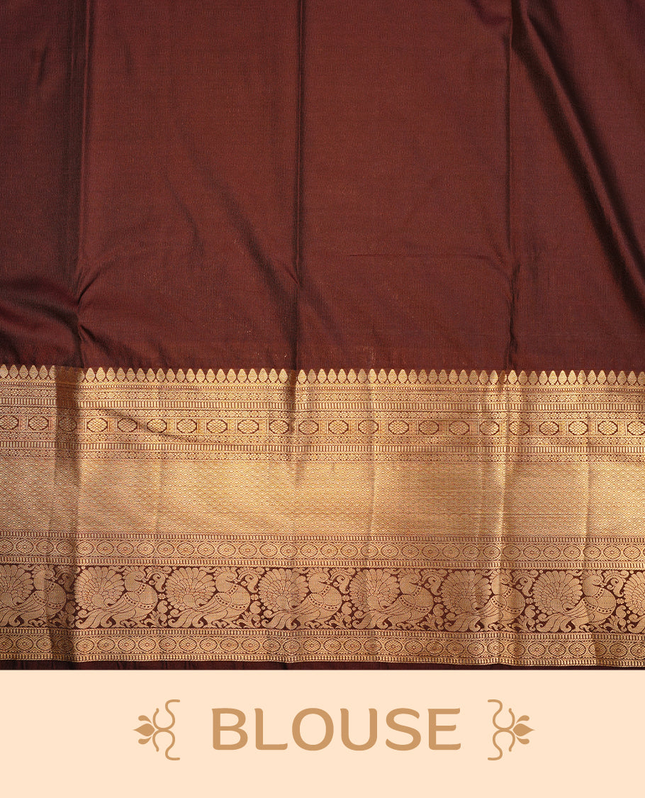Bottle green colour semi wedding saree featuring gold zari check with motifs on body, contrast chocolate colour with traditional border, paired with matching blouse piece.