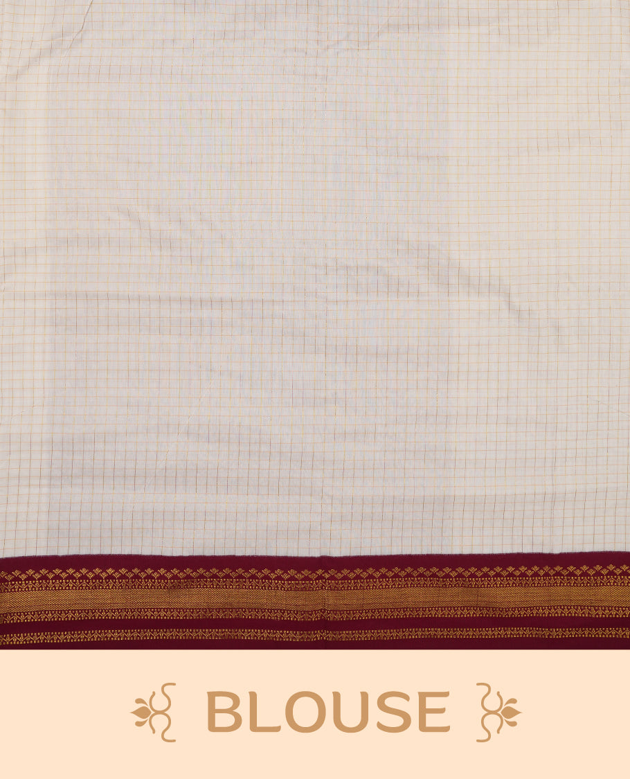 Off white coloured mixed Kalyani cotton saree featuring copper zari checks on the body, complemented by a maroon red coloured border and pallu adorned with golden zari patterns, Paired with a matching blouse.