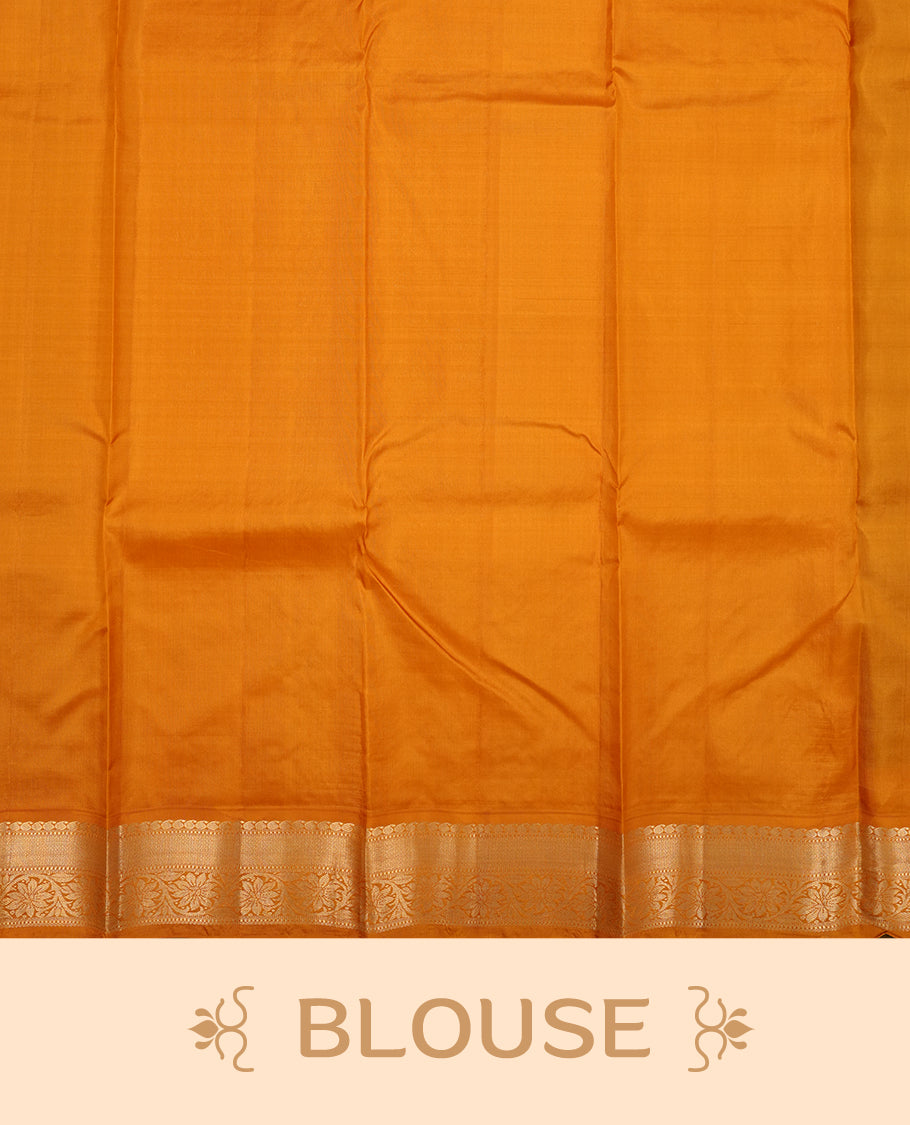 Black colour Vasundhara silk saree adorned with all-over gold chakkaram motifs on the body, complemented by a contrast turmeric colour with gold flower kodi motifs border and paired with a matching blouse piece.