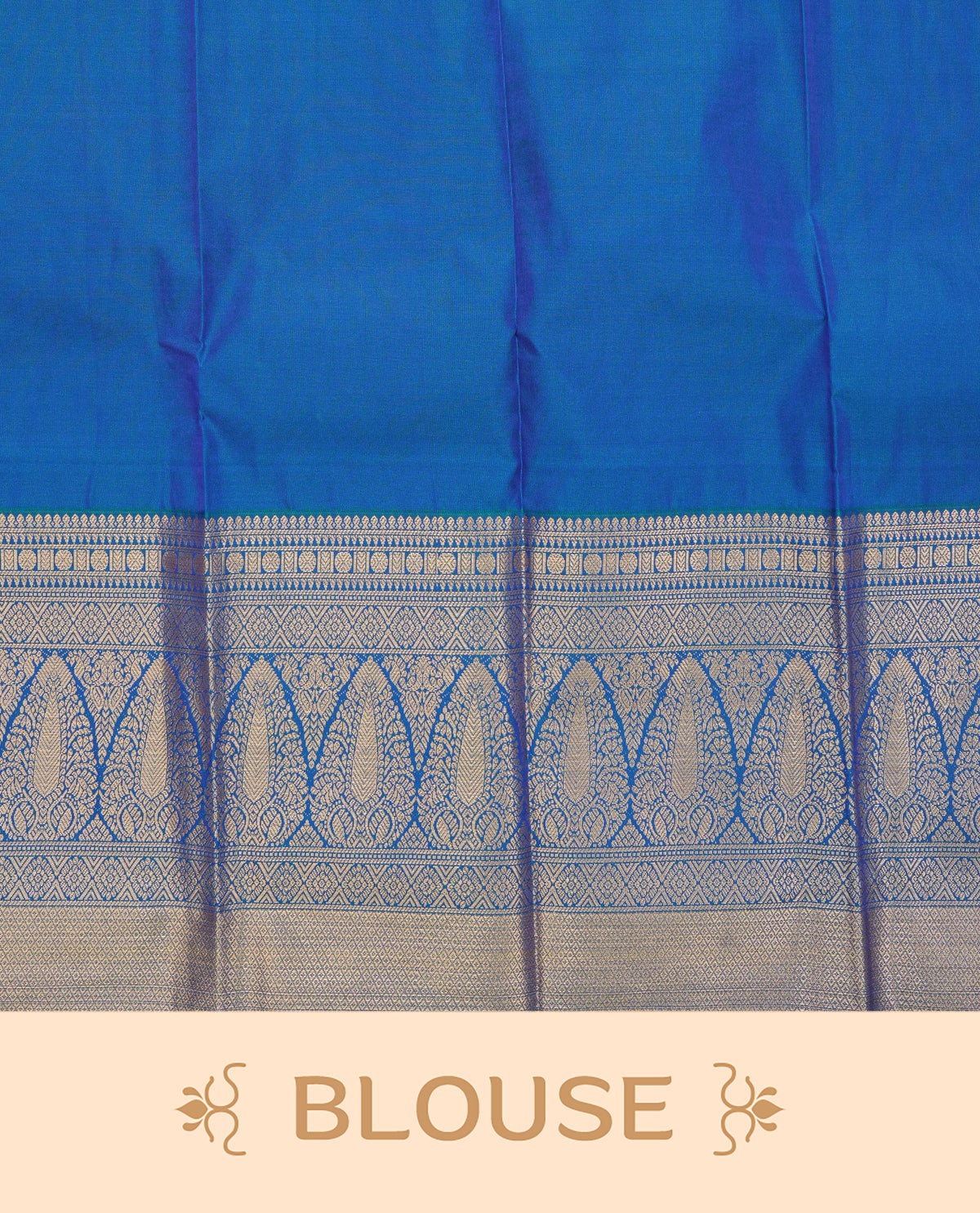 Peacock blue colour soft silk saree featuring gold zari buttas on body, contrast self colour gold zari traitionl border, grand pallu comes with matching blouse piece.