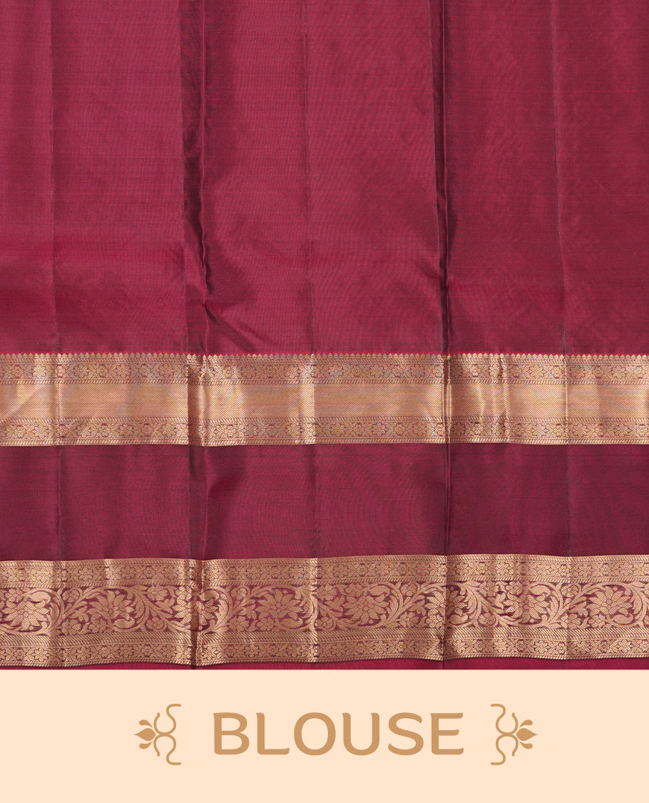 Green colour soft silk saree featuring gold zari motifs on the body, complemented by a contrast Maroon traditional zari border and pallu, paired with a matching blouse piece.