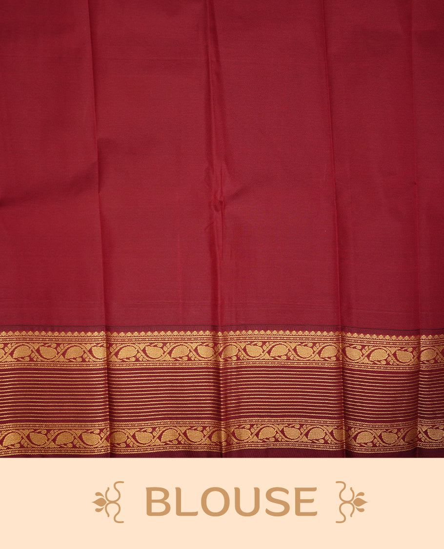 Mint green coloured soft silk saree featuring gold zari stripes and motifs across the body, enhanced with a contrast Maroon border and pallu, paired with a matching contrast blouse piece.