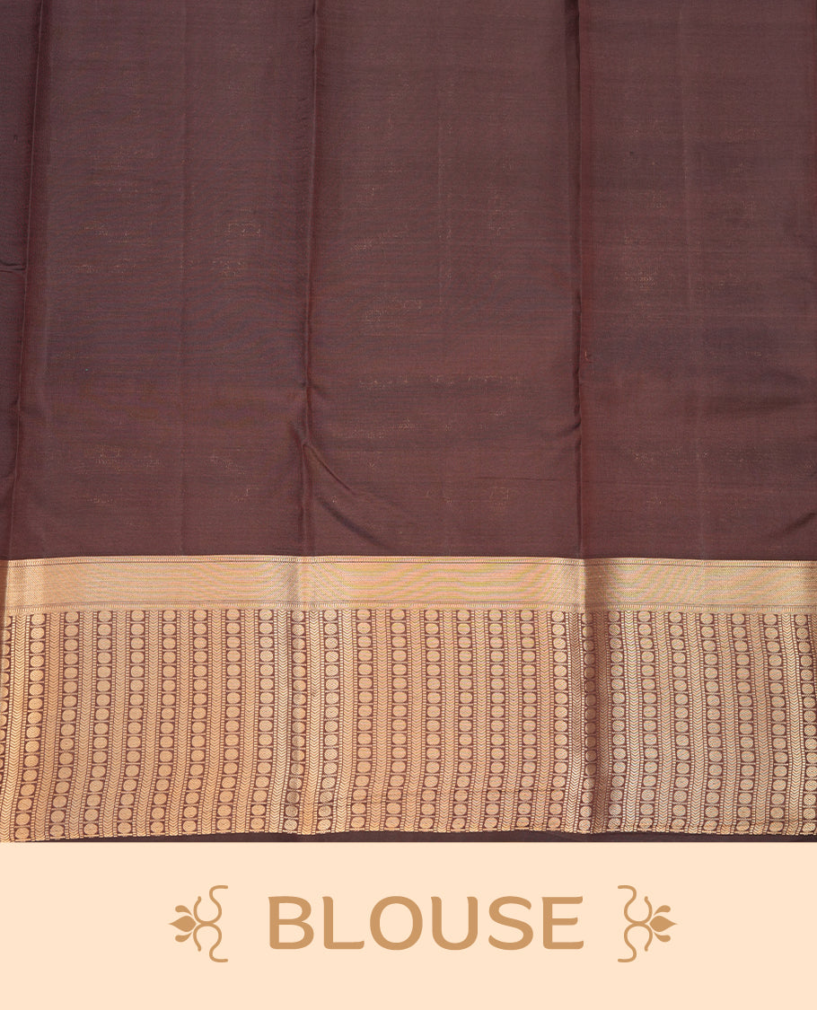 Burned orange colour Soft silk saree featuring gold zari motifs on the body, complemented by a contrast chocolate brown traditional zari border and pallu, paired with a matching blouse piece.