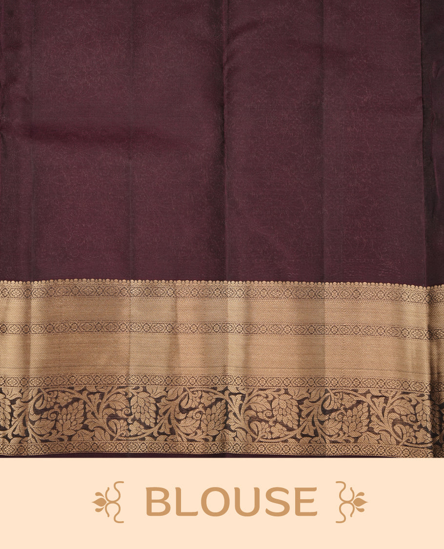 Green colour soft silk saree featuring gold zari motifs on the body, complemented by a contrast Dark purple traditional zari border and pallu, paired with matching blouse piece.