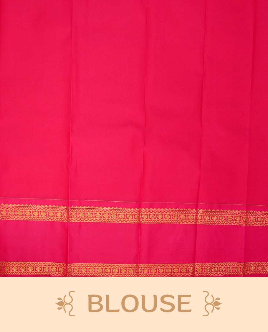 Mustard coloured soft silk saree featuring gold zari stripes and motifs across the body, enhanced with a contrast rani pink border and pallu, paired with a matching contrast blouse piece.