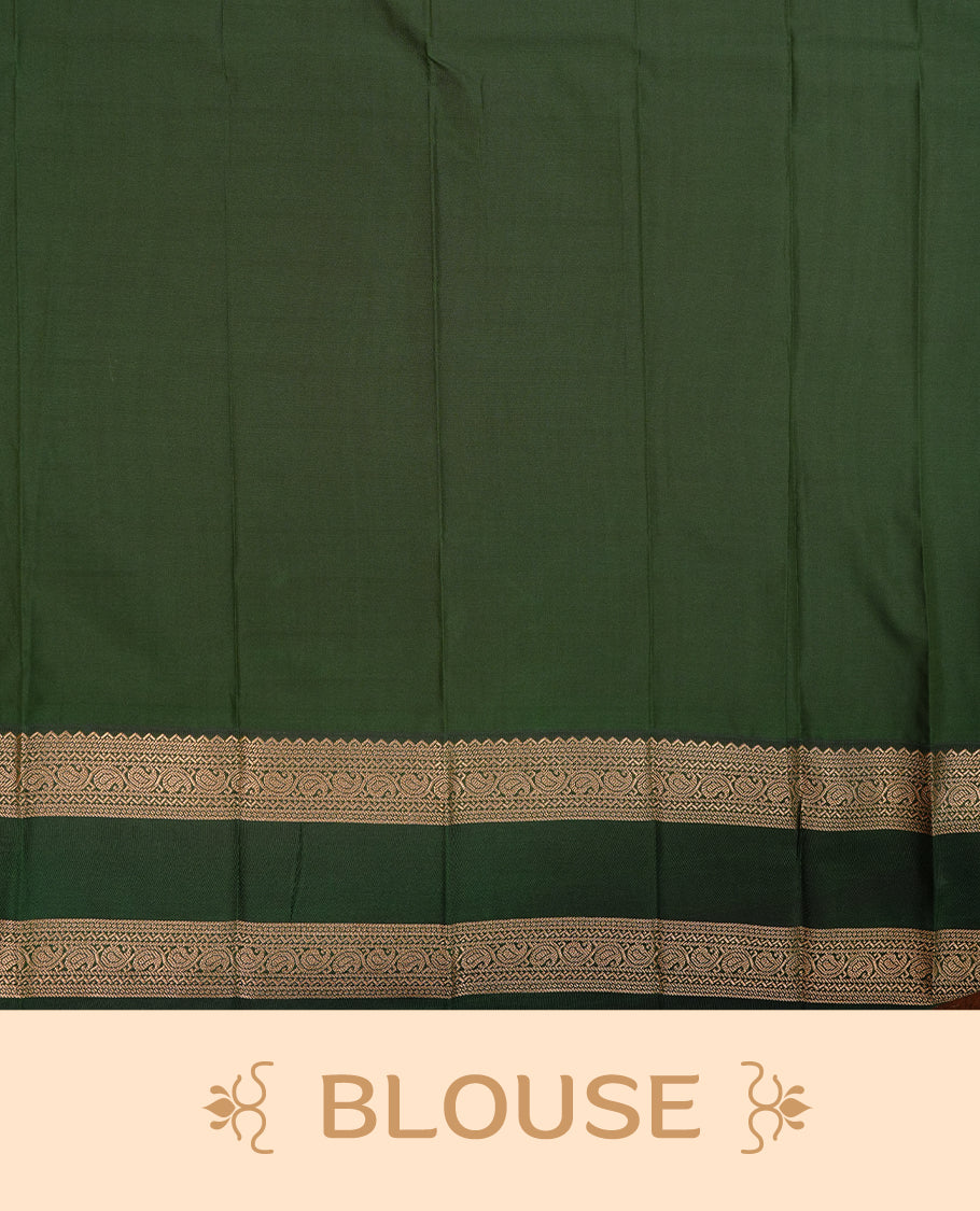 Rust orange coloured soft silk saree featuring gold zari stripes and motifs across the body, enhanced with a contrast Green border and pallu, paired with a matching contrast blouse piece.