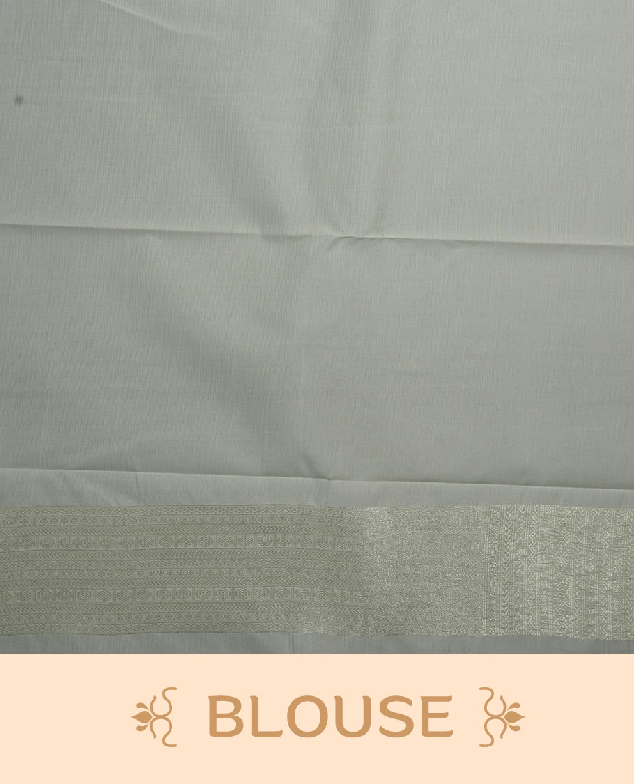 White colour soft silk saree featuring silver zari motifs on the body, complemented by a selfcolour traditional silver zari border and pallu, paired with a matching blouse piece.