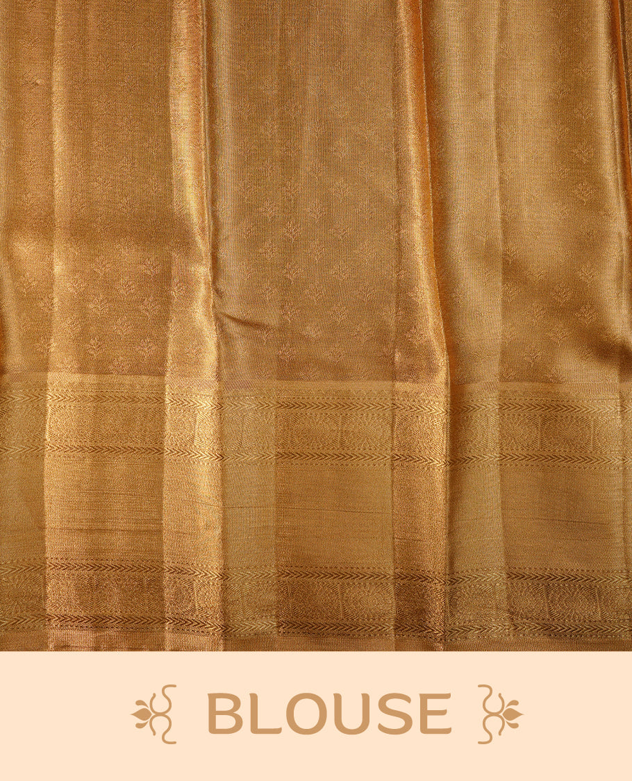 Gold colour semi tissue silk saree featuring gold zari pattern on body, self colour with gold zari traditional border, paired with matching blouse piece.