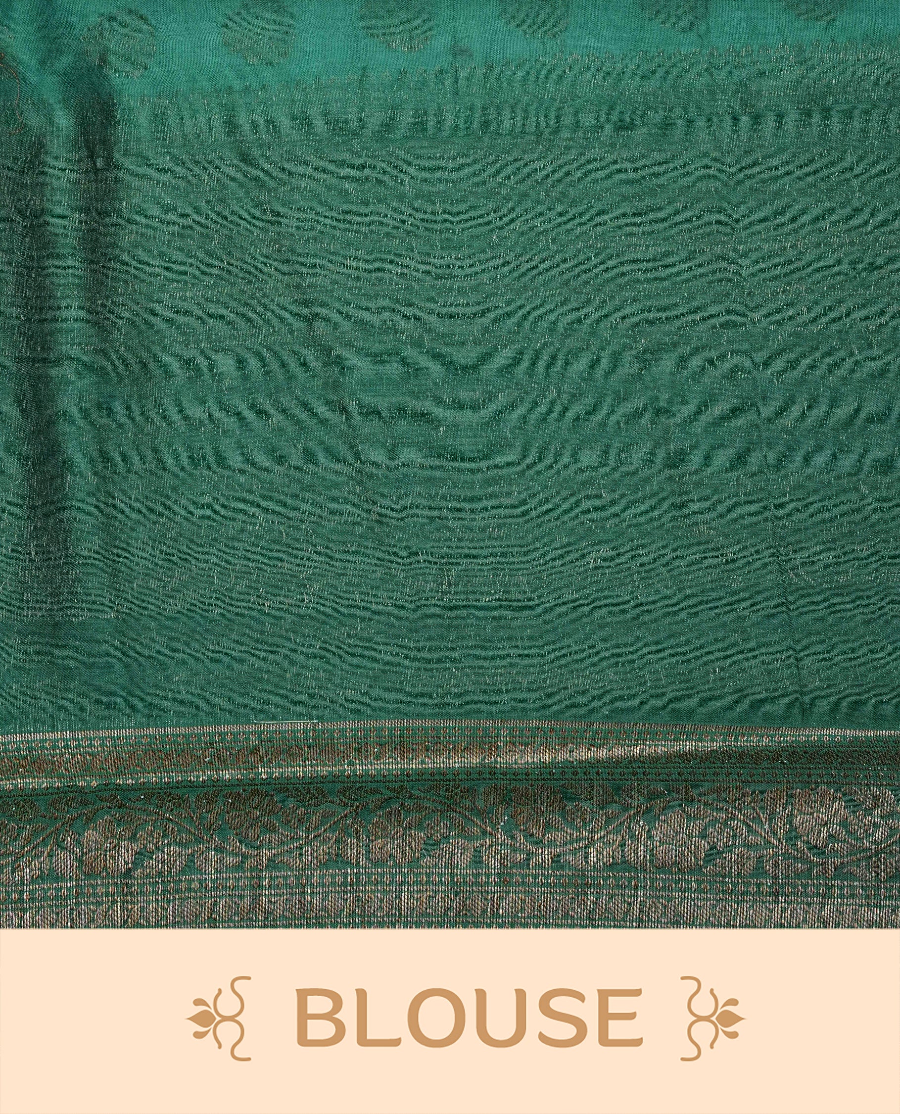 Light Sea Green Colour Tussar Silk saree adorned with antique zari butta motifs across the body, complemented by a contrasting bottle green floral zari border and pallu, paired with a matching blouse piece.