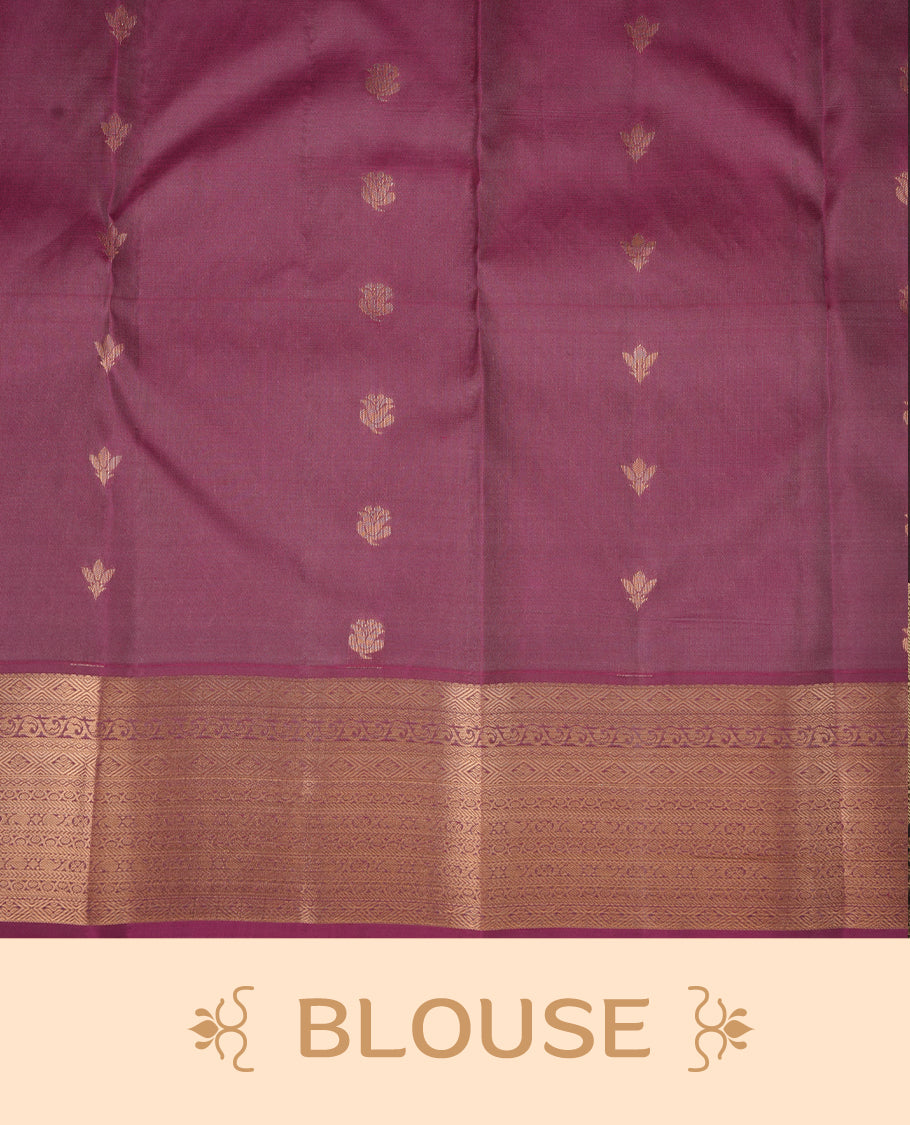 French lilac colour soft silk saree featuring gold zari motifs on the body, complemented by a contrast Magenta traditional zari border and pallu, paired with matching blouse piece.