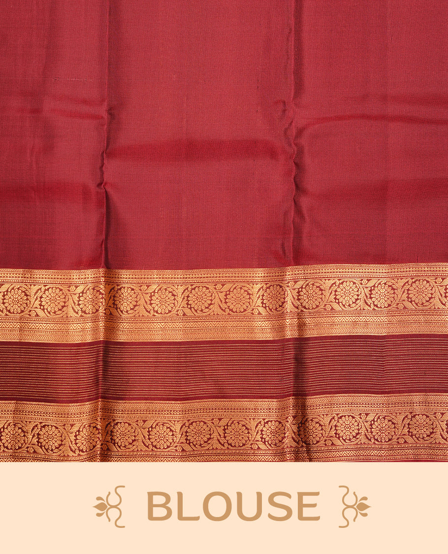 Navy blue colour traditional kancheepuram silk saree featuring gold zari strpies on body, complemented by contrast maroon colour with gold zari traditional border, paired with matching blouse piece.