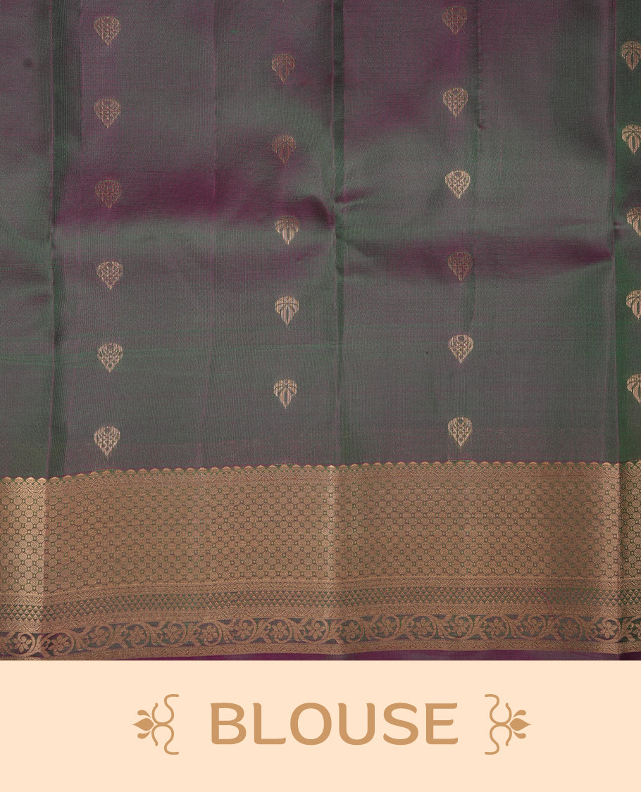 Peacock colour soft silk saree featuring gold zari motifs on the body, complemented by a contrast Magenta traditional zari floral kodi border and pallu, paired with a matching blouse piece.