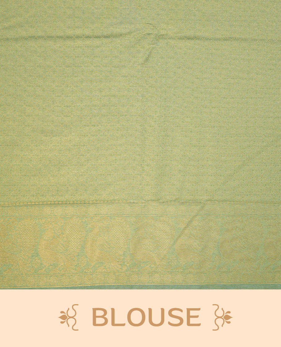 Ice green colour semi soft silk saree featuring gold zari motifs on across body, self colour border with traditional gold zari pattern, pallu and paired with matching blouse.