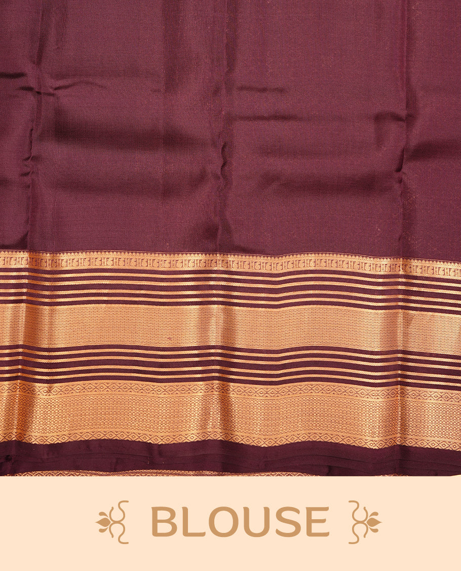 Burnt orange colour traditional kancheepuram silk saree featuring gold zari motifson body, complemented by contrast burgundy colour with gold zari traditional border, paired with matching blouse piece.