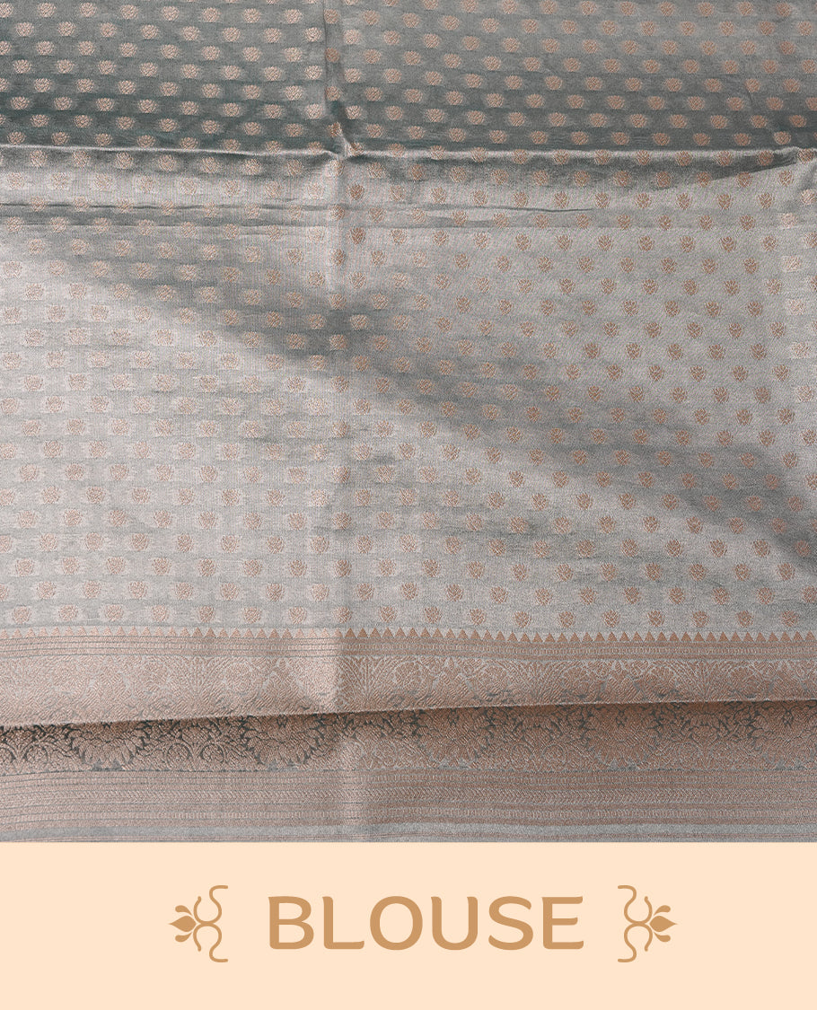 Pastel Blue colour semi tissue silk saree featuring floral zari motifs on body, complemented by gold zari traditional border, paired with matching blouse piece.