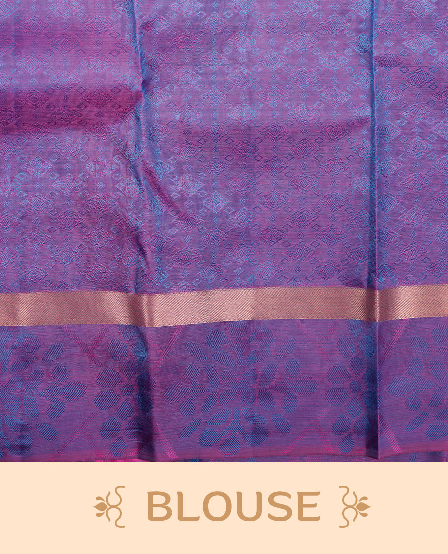 Peacock colour soft silk saree featuring gold zari motifs on the body, complemented by a contrast Indigo traditional zari kodi border and pallu, paired with a matching blouse piece.