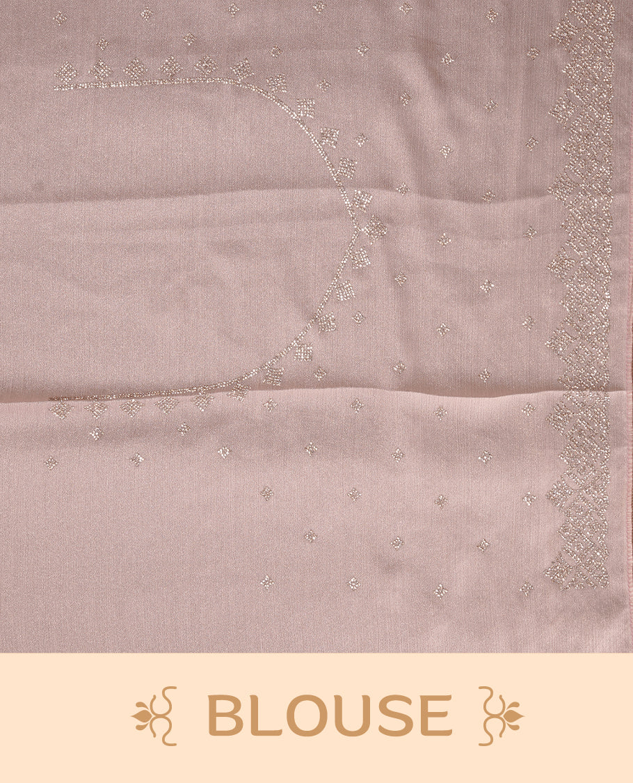 Light peach colour organza designer saree featuring Gold stone motifs on body, highlighting light weight stone worked border, paired with matching blouse piece.