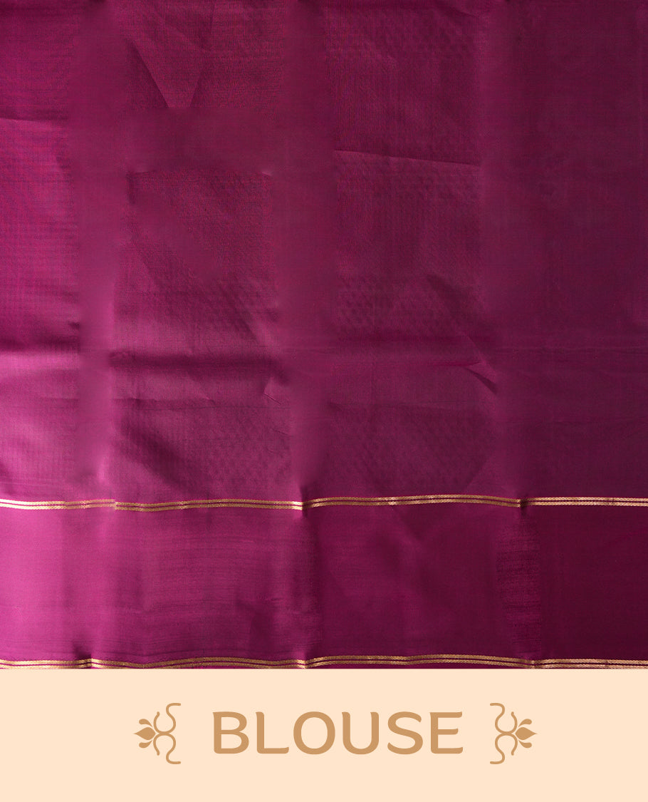 Leaf green colour soft silk saree adorned with intricate self striped, enhanced by a vibrant magenta pink zari border and pallu with rich detailing & paired with a matching blouse.