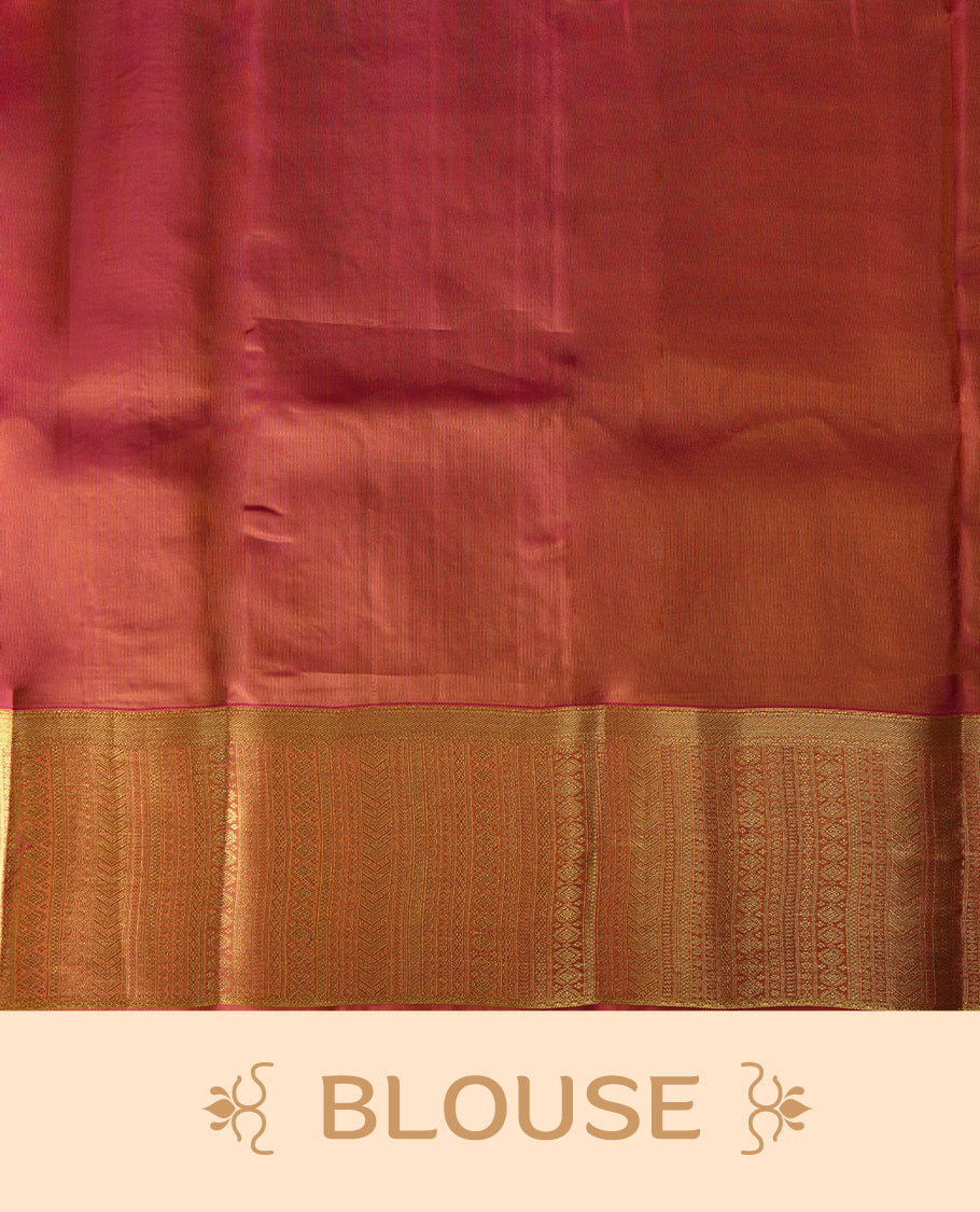 Ochre yellow colour soft silk saree adorned with small golden buttas, enhanced by a rich gold zari border and pallu with intricate detailing & paired with a matching blouse.
