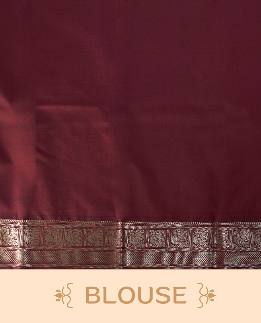 Dark green colour soft silk saree with silver buttas, enhanced by a vibrant maroon zari border and pallu, paired with a matching blouse.