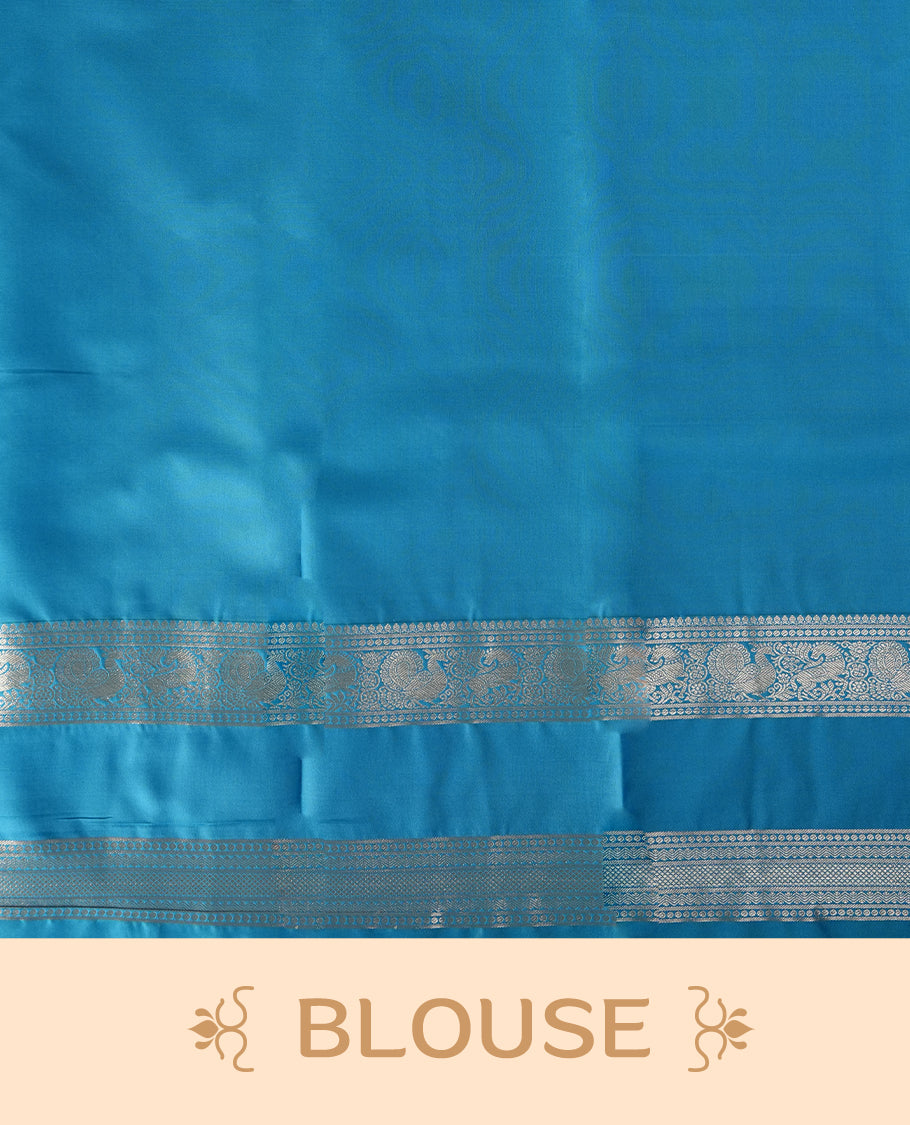 Sky blue colour soft silk saree with delicate silver zari buttas, complemented by a shimmering silver border and pallu & Paired with a matching blouse.