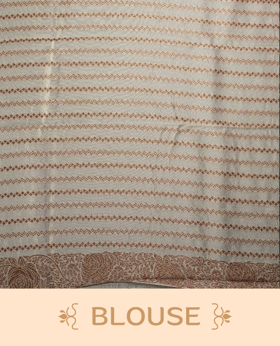 Pastel cream colour semi Banarasi Tussar Georgette saree with soft peach, lilac, and sage yellow floral motifs, antique gold zari border, and intricately woven pallu. Comes with matching blouse piece.