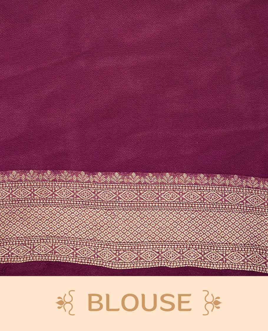 Burgundy colour semi Banaras crepe silk saree featuring an elegant gold zari patterned body, highlighted by a plain border adorned with traditional gold zari cow motifs. Paired with a matching blouse piece.