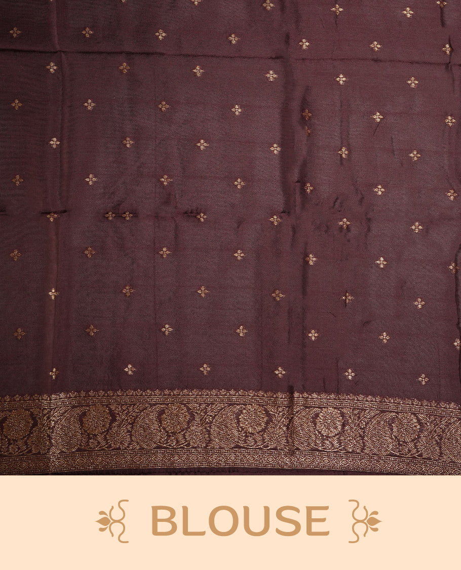 Coffee brown colour semi Banarasi Tussar Georgette saree with gold zari motifs on the body, a grand woven golden pallu, and ornate zari border. Includes a matching blouse piece for a complete look.