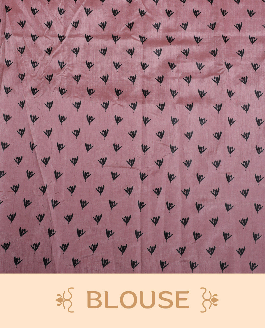 Pastel Pink colour Semi tussar silk saree adorned with black floral prints on the body and an elegant pallu & Comes with a matching blouse piece for a classy look.