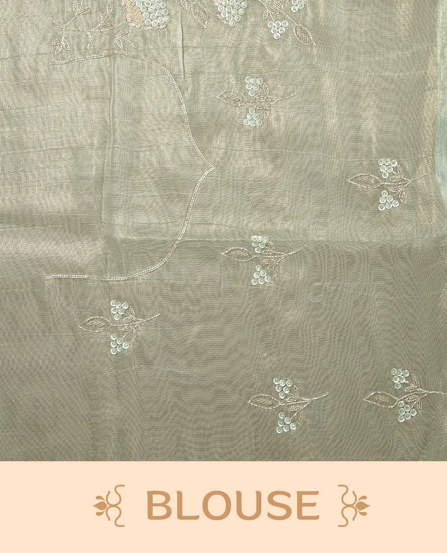 Pastel green colour net organza saree featuring thread, sequins, cut beats worked on body, highlighting scalp border, paired with matching blouse piece.
