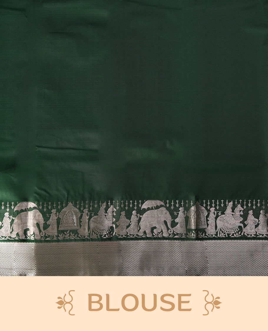 Dark green colour soft silk saree adorned with copper shade buttas, accentuated by a contrasting copper zari border and pallu with intricate motifs & Paired with a matching blouse.