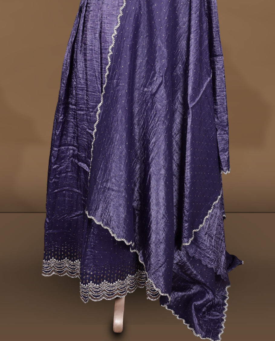 Dark purple colour stitched gown set with sleeveless embroidered yoke, flared ankle‑length silhouette, and attached dupatta featuring dainty butti work and scalloped beaded edging.