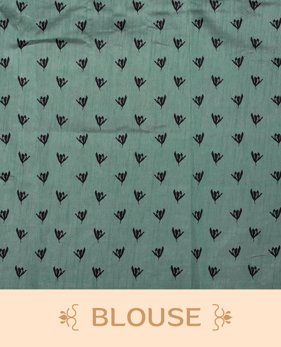 Pastel Green colour Semi tussar silk saree adorned with black floral prints on the body and an elegant pallu & Comes with a matching blouse piece for a classy look.