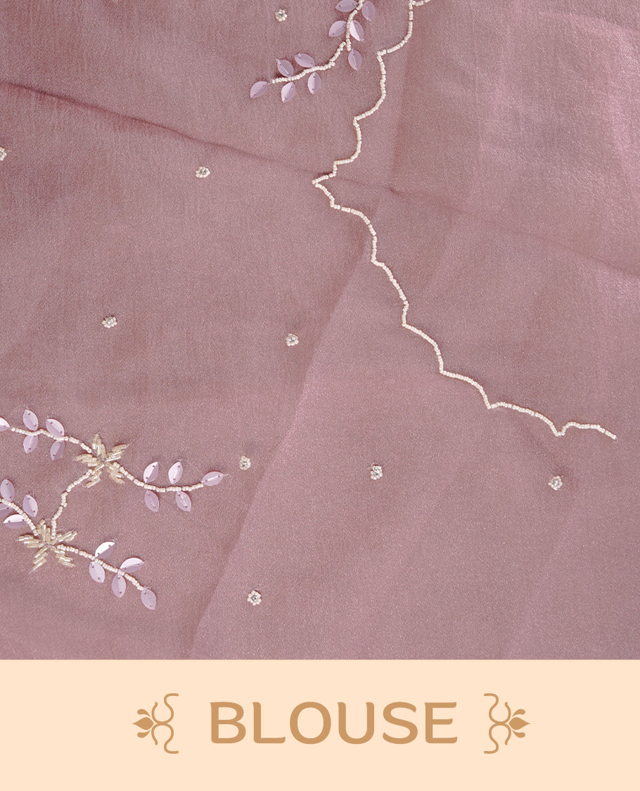 Pink colour crush organza saree featuring white floral work with beats & sequins, highlighting scalp with beats worked border, paired with matching blouse piece.