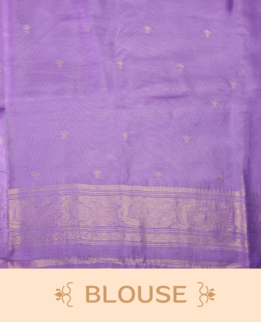 Lavender colour saree featuring subtle woven floral motifs with a lustrous finish, complemented by delicate tassels on the pallu, and paired with a matching blouse