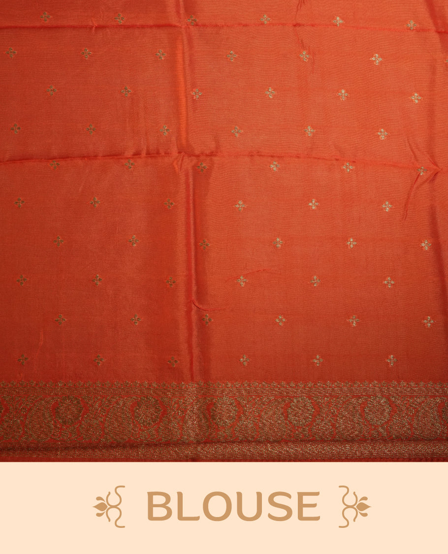 Orange colour semi Banarasi Tussar Georgette saree with gold zari motifs on the body, a grand woven golden pallu, and ornate zari border. Includes a matching blouse piece for a complete look.