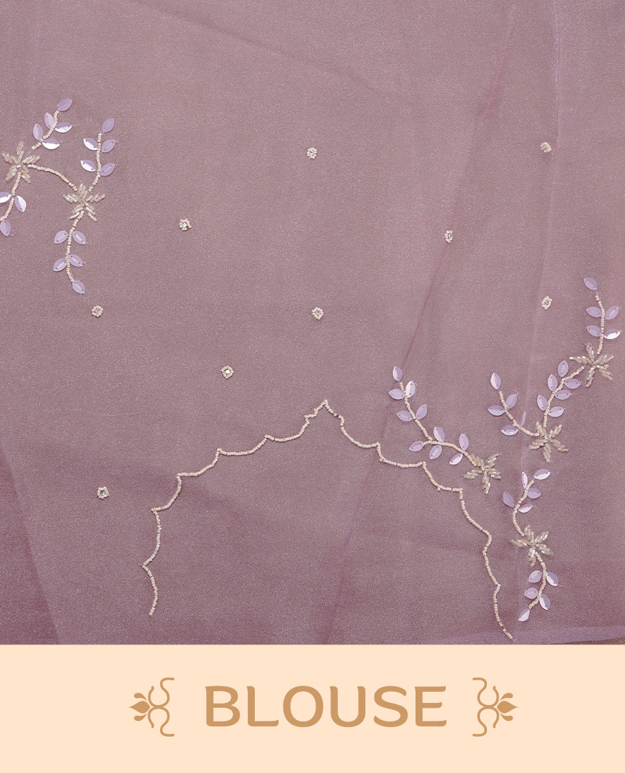 Pastel lavender colour crush organza saree featuring white floral work with beats & sequins, highlighting scalp with beats worked border, paired with matching blouse piece.