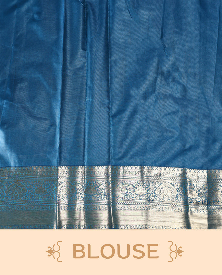 Steel blue semi silk brocade saree featuring intricate silver brocade motifs across the body, enhanced by a gleaming silver woven border and pallu, Paired with a matching blouse for a refined traditional look.