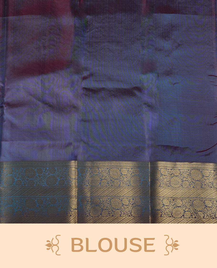 Parrot green colour soft silk saree adorned with golden zari motifs, enhanced by a rich purple zari border and pallu with intricate designs & paired with a matching blouse.