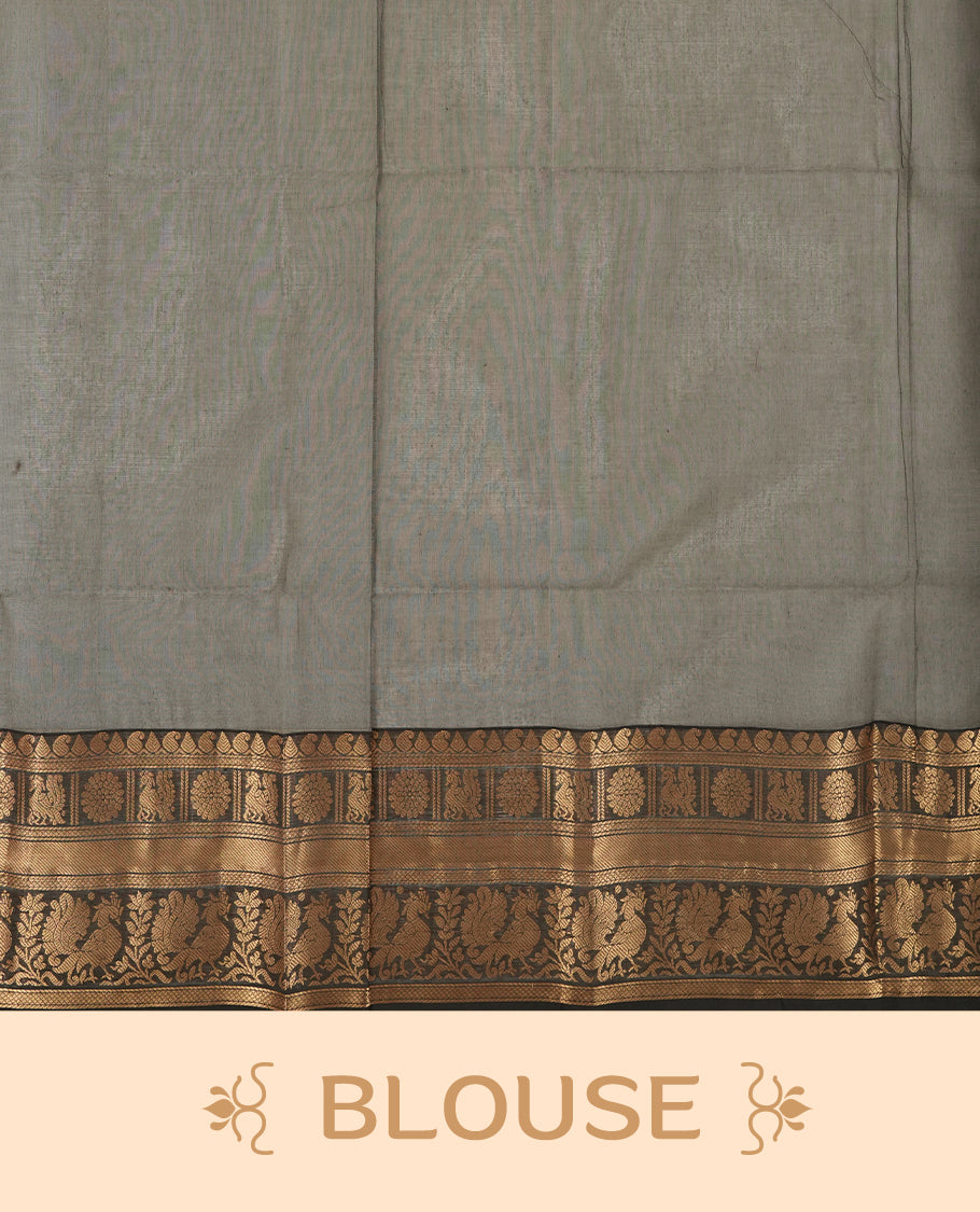 Grey colour Chettinad cotton saree featuring fine golden zari lines on the body, The contrasting black border is richly woven with intricate zari floral and paisley motifs & Comes with a matching blouse piece.